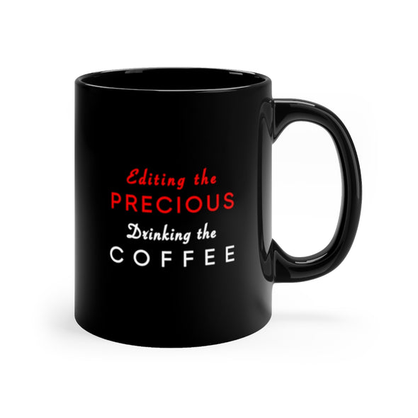 Black, 11 ounce, ceramic mug with the words Editing the Precious, Drinking the Coffee in white and red.