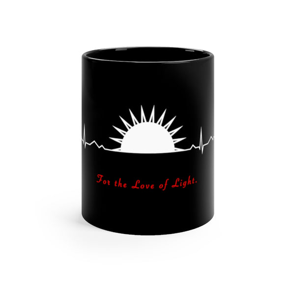 Black, 11 ounce, ceramic mug with the words For the Love of Light in white and red and an illustration of a heartbeat with a sunset.