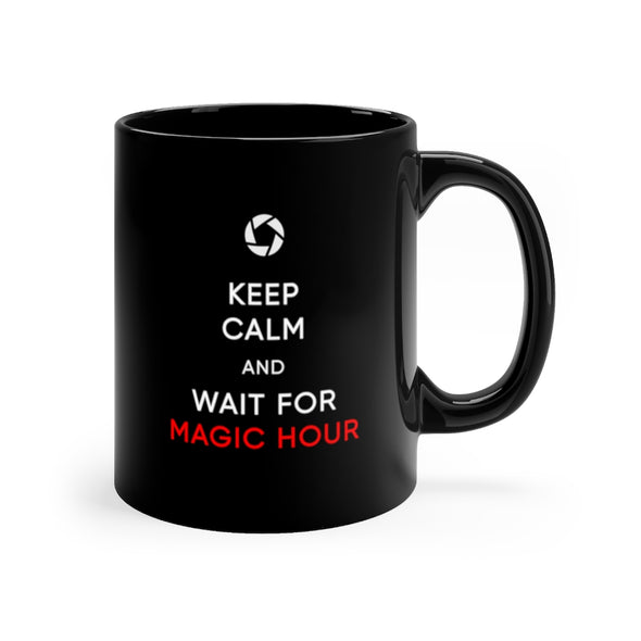 Black, 11 ounce, ceramic mug with the words "Keep Calm and Wait for Magic Hour" in white and red.