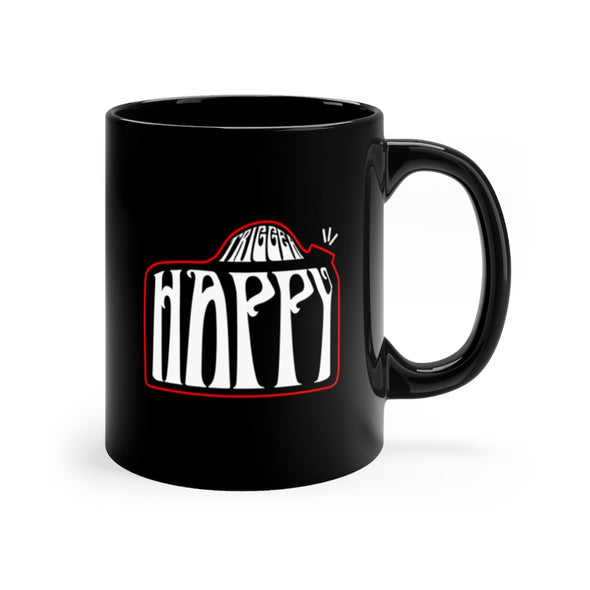 Black, 11 ounce, ceramic mug with the words "Trigger Happy" in white and red, in the shape of a 35millimeter camera.